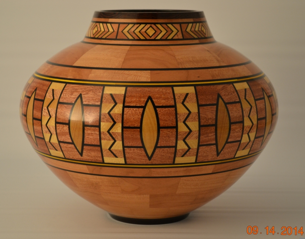 Vase – 11-1/4” diameter X 9” tall – woods used: Cherry, Mahogany, Yellowheart, Wenge and dyed veneer – 870 pieces of wood 1404